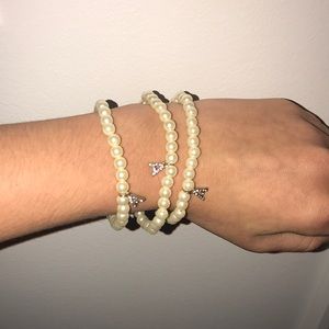 3 pearl bracelets with A charm